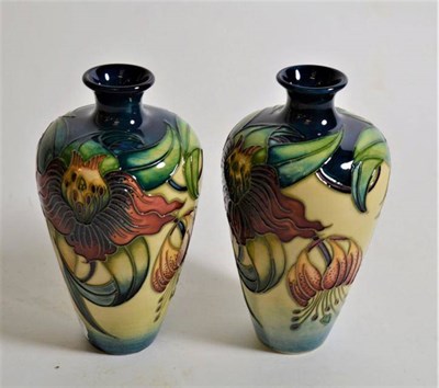 Lot 270 - Modern Moorcroft pottery: a pair of 'Anna Lily' pattern vases designed by Nicola Slaney, 16cm...