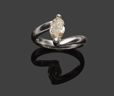 Lot 394 - A Marquise Cut Diamond Solitaire Ring, the diamond held in a white two prong twist setting to a...