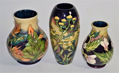 Lot 278 - Modern Moorcroft pottery: a 'H.G. Mallow' pattern vase 13cm, a 'Burdock' vase 15cm, a 'H.G....