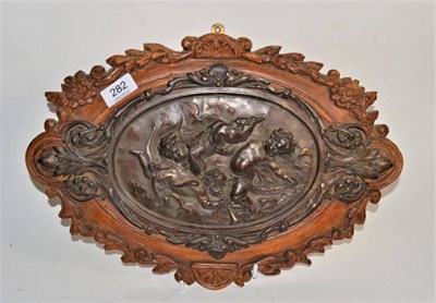 Lot 282 - Italian School (19th century) decorative bronzed spelter plaque of playing Putti