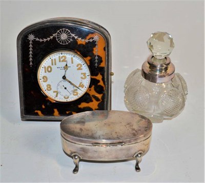 Lot 303 - A silver and tortoiseshell pocket watch holder and pocket watch; a silver ring box; and a cut glass