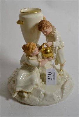 Lot 310 - A Royal Worcester porcelain figure group of a boy and girl at a fountain by James Hadley,...