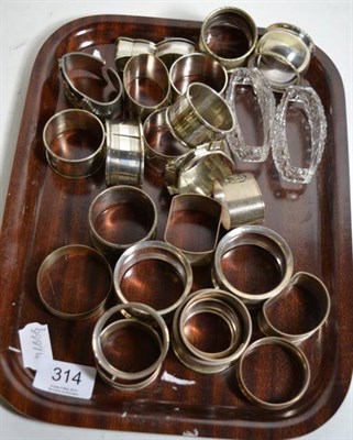 Lot 314 - A collection of silver and plated napkin rings together with a silver gilt collar