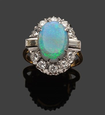 Lot 398 - A Black Opal and Diamond Cluster Ring, the oval slab opal within a border of round brilliant...