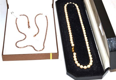 Lot 318 - A two colour necklace, stamped '375', length 45cm; and a cultured pearl necklace, with a 9...