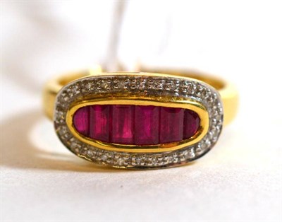 Lot 319 - An 18 carat gold ruby and diamond cluster ring, finger size K1/2