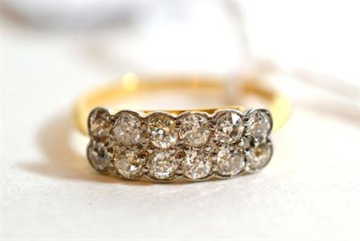 Lot 325 - A two row diamond ring, marks rubbed, finger size M1/2