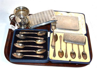 Lot 347 - Silver to include two cased sets of six teaspoons, a Christening mug, two cigarette cases, a...