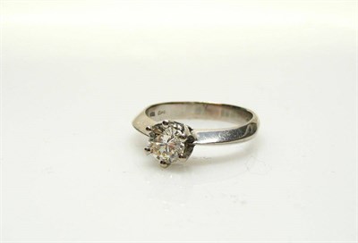 Lot 402 - A Platinum Diamond Solitaire Ring, a round brilliant cut diamond in a six claw setting to knife...