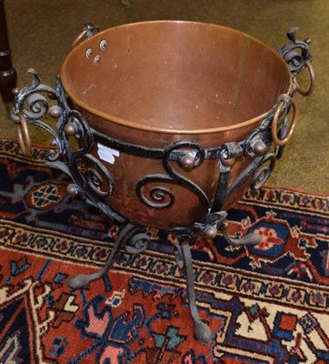 Lot 377 - A copper planter in painted iron stand