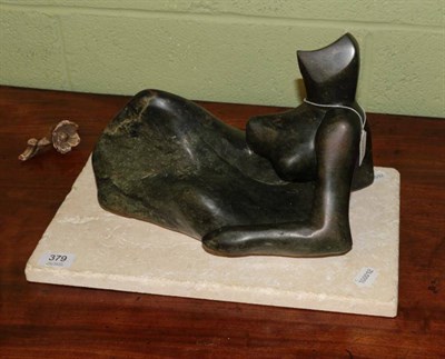 Lot 379 - Janet Hollins (Contemporary) After Henry Moore, female figure, carved opal stone, on limestone...