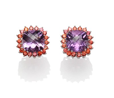 Lot 406 - A Pair of Amethyst and Orange Sapphire Cluster Earrings, Dutch rose cut amethysts within a...