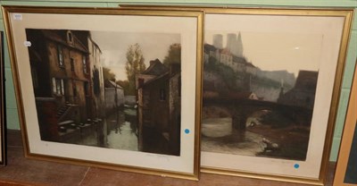 Lot 1017 - After Henri Tourday, a Continental canal scene, together with a river and town scape, colour...
