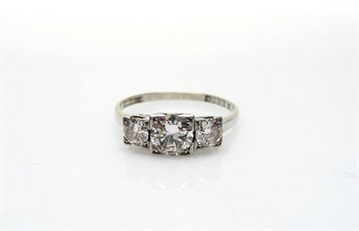 Lot 417 - A Diamond Three Stone Ring, the graduated round brilliant cut diamonds held in white squared...