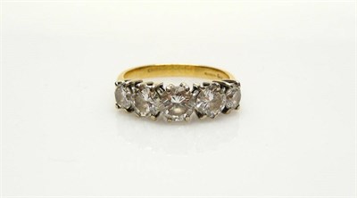 Lot 421 - An 18 Carat Gold Diamond Five Stone Ring, graduated round brilliant cut diamonds in white claw...