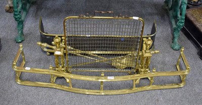 Lot 1178 - A group of brass fireside items comprising a pair of andirons, a set of three fire tools, spark...