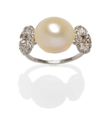 Lot 427 - A Pearl and Diamond Ring, a pearl (untested) flanked by two loops set with old cut diamonds,...