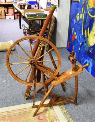 Lot 1239 - A 19th century Continental spinning wheel and a telescope