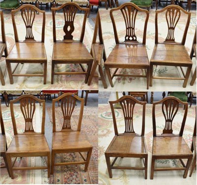 Lot 1242 - A harlequin set of eight elm plank seated dining chairs
