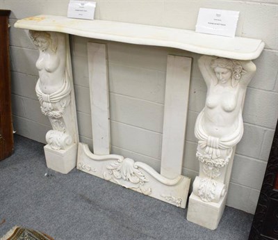 Lot 1249 - A carved marble fire surround with caryatid supports