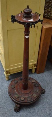 Lot 1251 - A Victorian mahogany snooker cue stand, on lion paw feet