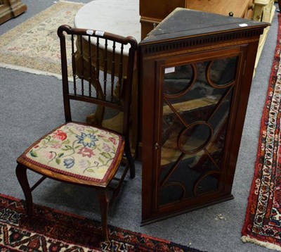 Lot 1255 - An Edwardian Sheraton revival corner cabinet; and a spindle back chair with upholstered seat