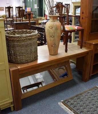Lot 1260 - An oak dining table; an oak framed mirror; a wicker log basket; a decorative vase and a...