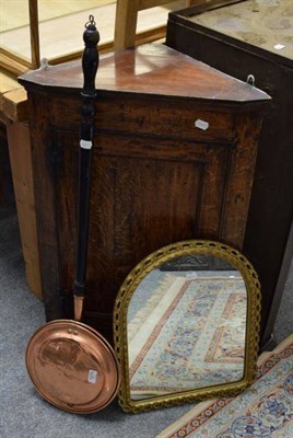 Lot 1275 - An oak corner cabinet; a gilt framed mirror; and a copper bed warming pan (3)