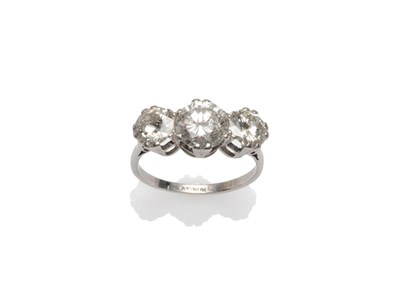 Lot 432 - A Diamond Three Stone Ring, the graduated round brilliant cut diamonds in white claw settings,...