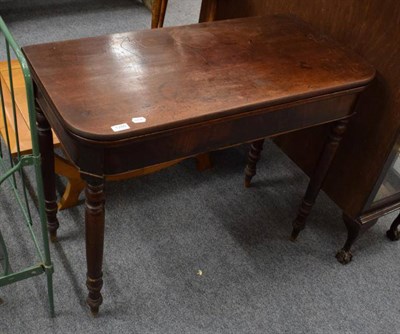 Lot 1280 - A 19th century mahogany fold over tea table