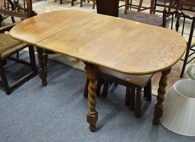 Lot 1286 - An oak table with boldly turned legs