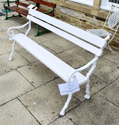 Lot 1290 - A 19th century cast iron branch form garden seat, re-painted white