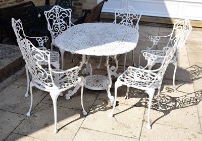 Lot 1292 - A white painted metal oval garden table and six matching chairs