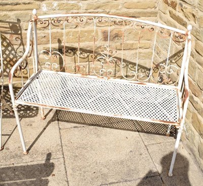 Lot 1293 - A modern white painted metal folding garden bench and two matching chairs (a.f.)