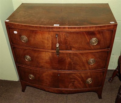 Lot 1305 - A George III mahogany bow fronted three height chest of drawers
