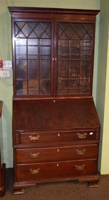 Lot 1307 - An Edwardian mahogany, glazed bureau bookcase with fully fitted and inlaid interior