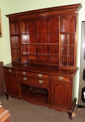 Lot 1319 - An early 20th century mahogany dresser and rack, the upper section with shelves flanked by twin...
