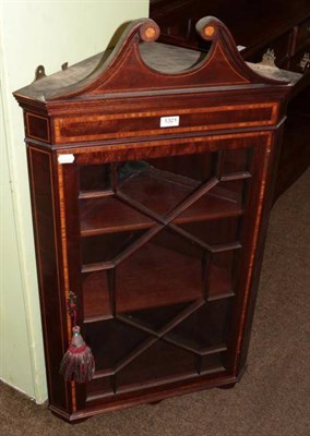 Lot 1321 - An inlaid mahogany astragal glazed hanging corner cupboard