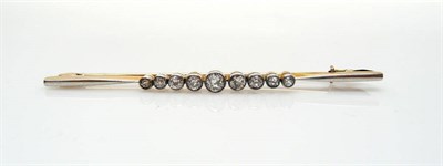 Lot 437 - A Diamond Bar Brooch, the graduated old cut diamonds in white millegrain settings on a tapered bar