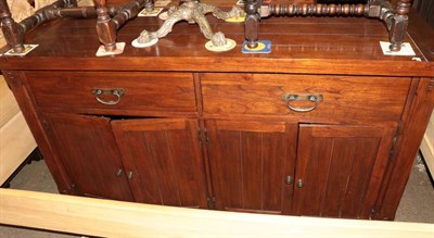 Lot 1332 - A modern hardwood sideboard with two drawers and four cupboard doors