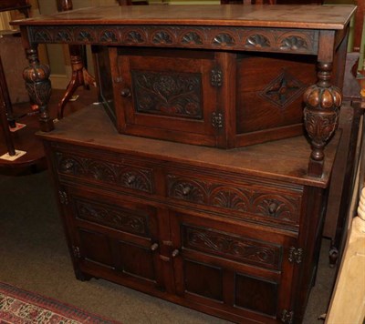 Lot 1334 - A 20th century lunette carved oak court cupboard