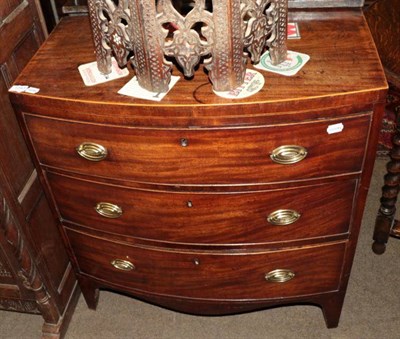 Lot 1343 - A George III mahogany bow fronted three height chest of drawers