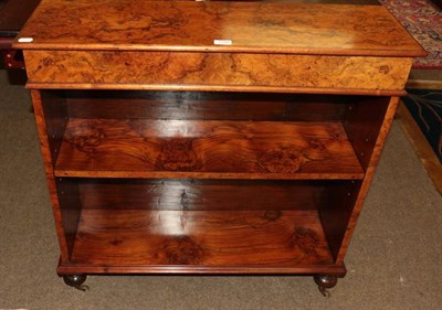 Lot 1349 - A Victorian walnut bookcase with turned feet and brass castors