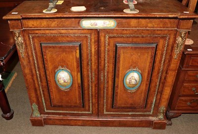 Lot 1354 - A 19th century figured walnut pier cabinet