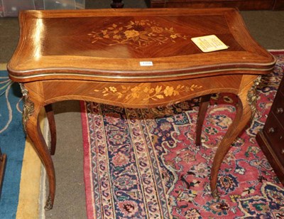 Lot 1358 - A late Victorian marquetry inlaid, rosewood serpentine fronted fold over card table, the...