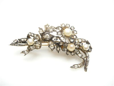 Lot 442 - A Pearl and Diamond Spray Brooch, the floral spray set with pearls and old and rose cut...