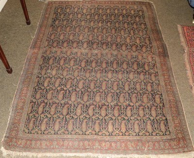 Lot 1384 - A 19th century Senneh rug, the indigo field of boteh enclosed by narrow madder borders, 180cm...