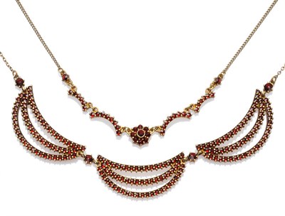 Lot 443 - Two Garnet Necklaces, one with curved stone set links and a central cluster to a trace link...