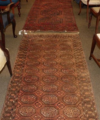 Lot 1387 - Turkmen rug, the madder field with three elephant foot guls enclosed by borders of hooked...