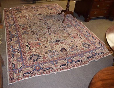 Lot 1394 - Tabriz carpet, Persian Azerbaijan, the cream field of angular vines and stylised palmettes enclosed